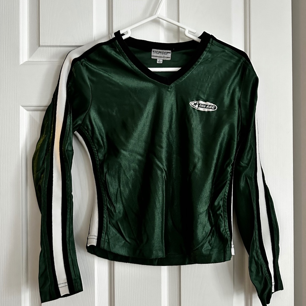 Green long sleeved top with athletic looking  stripes on the sleeves.